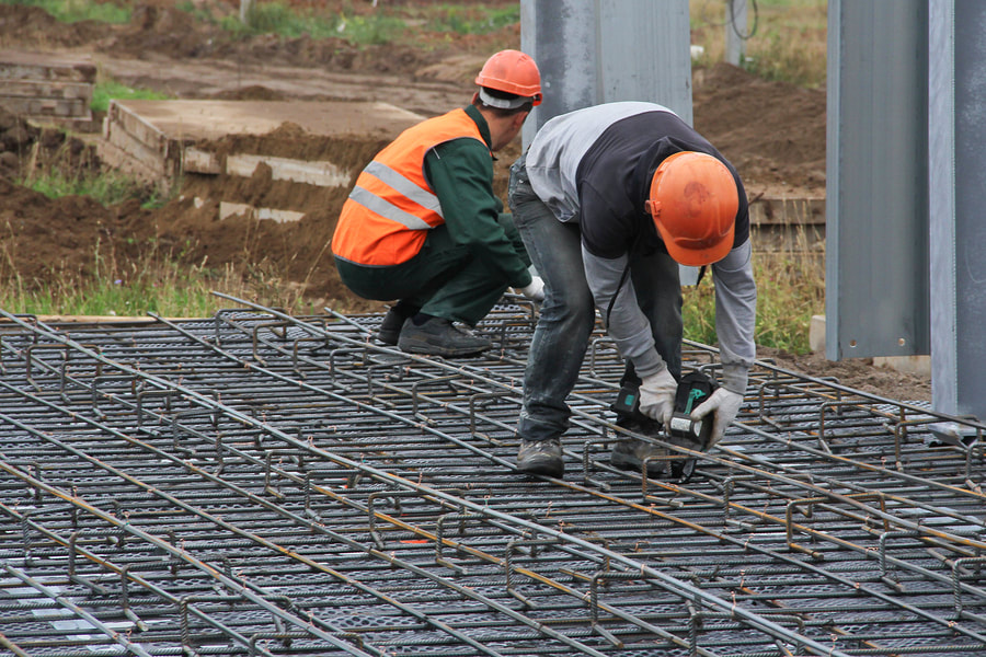 two workers in the site